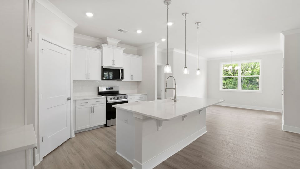 Kitchen with island and cabinets.