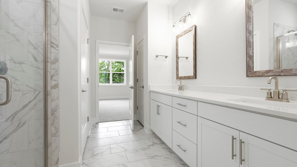 Primary bathroom with double vanity sinks.