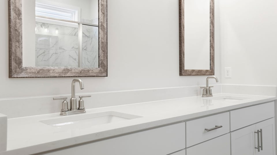 Primary bathroom with double vanity sinks.