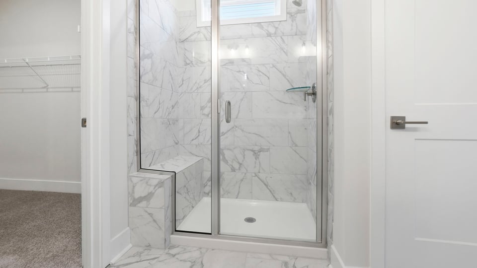 Primary bathroom with double vanity sinks.