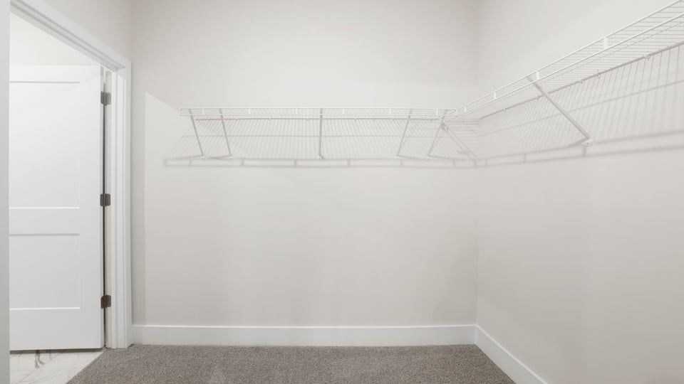 Primary closet with shelf/
