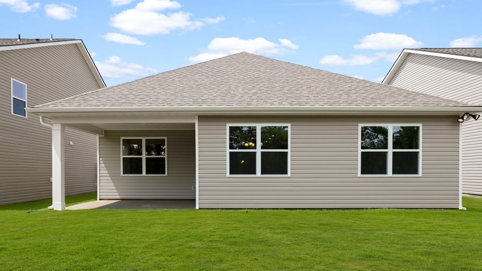 Back exterior with large backyard.