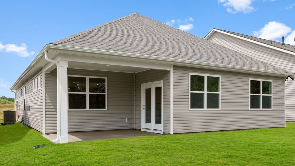 Back exterior with large backyard.