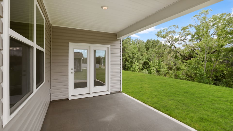 Back exterior with large backyard.