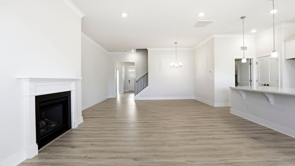 View from family room of the kitchen and hallway to the entrance.