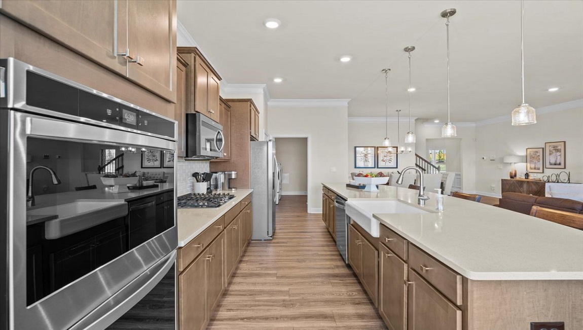 Kitchen with island and quartz countertops.