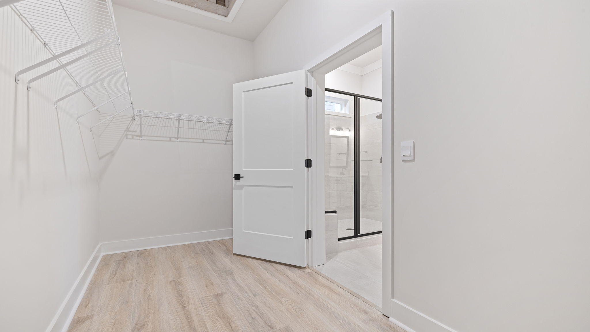 Primary bedroom walk-in closet.