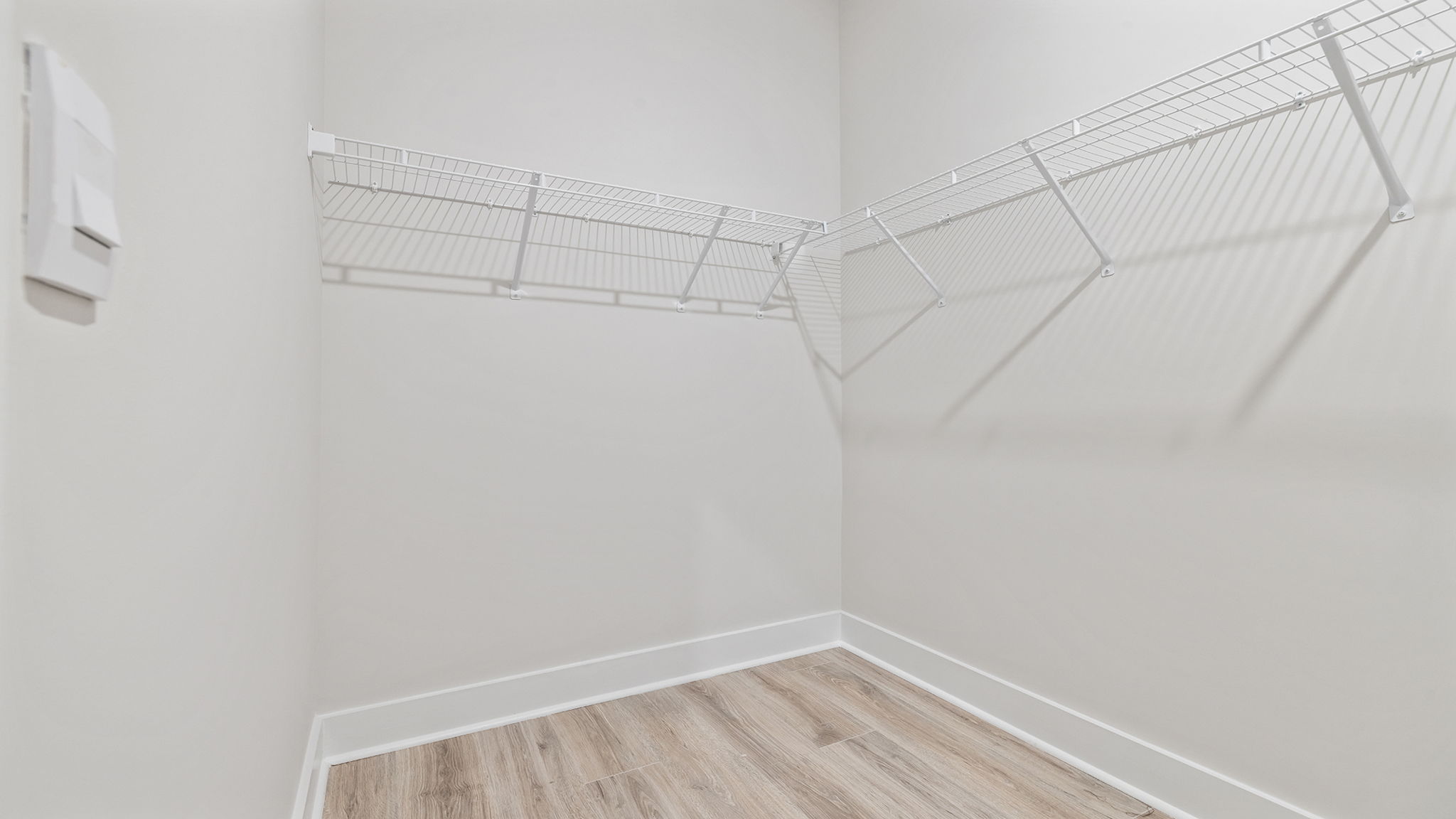 Primary bedroom walk-in closet.