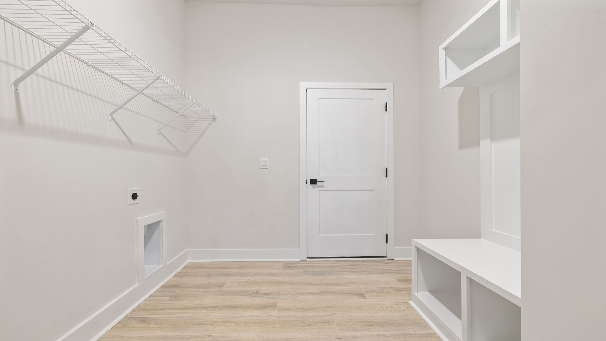 Laundry room with shelving.