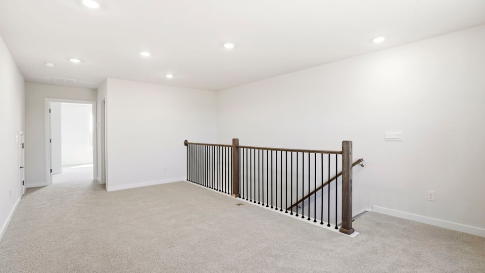 Upper-level landing and loft area.