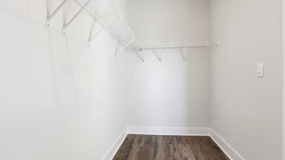 Primary bedroom walk-in closet.