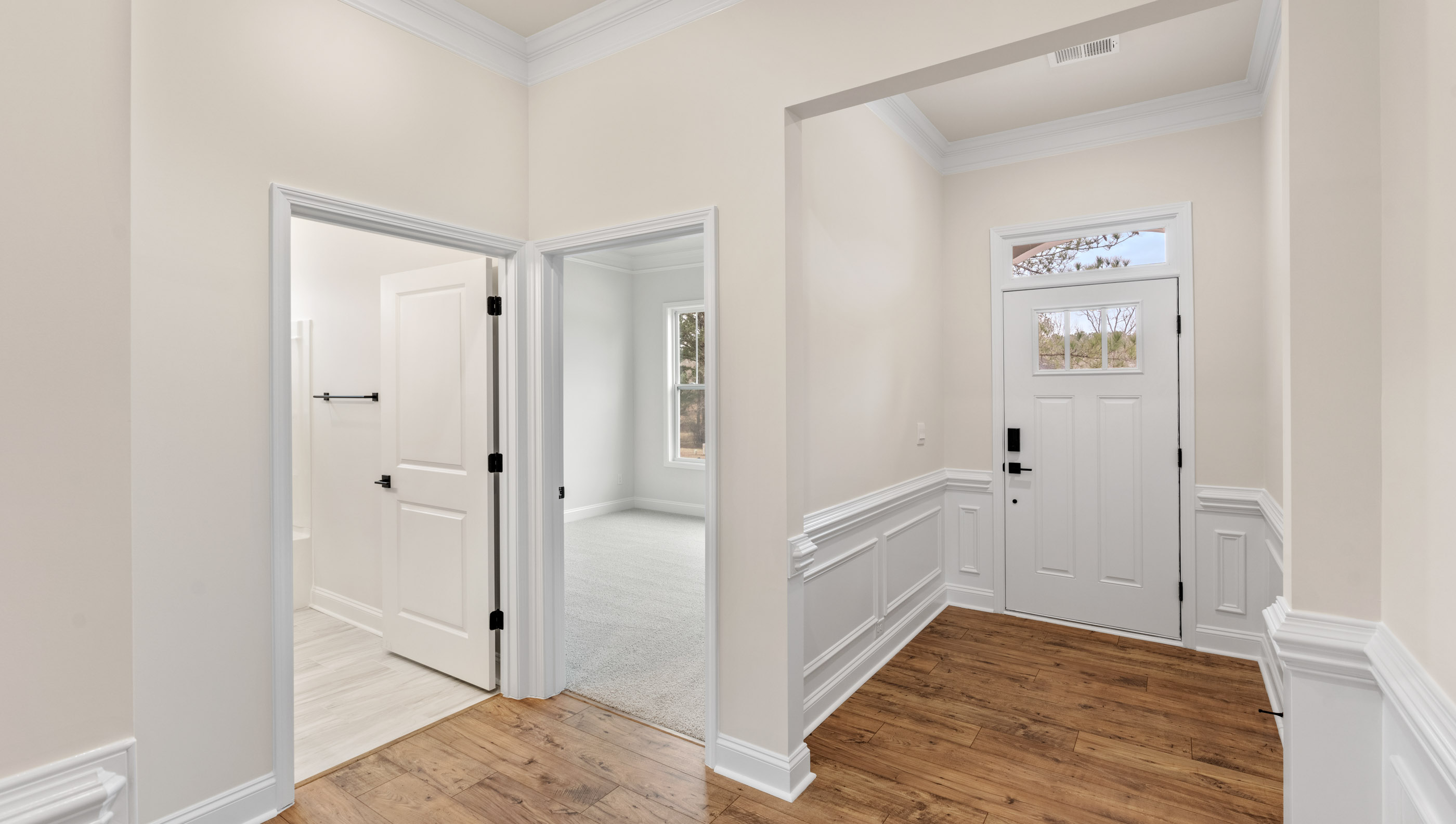 Entry way into home with view of hallway.