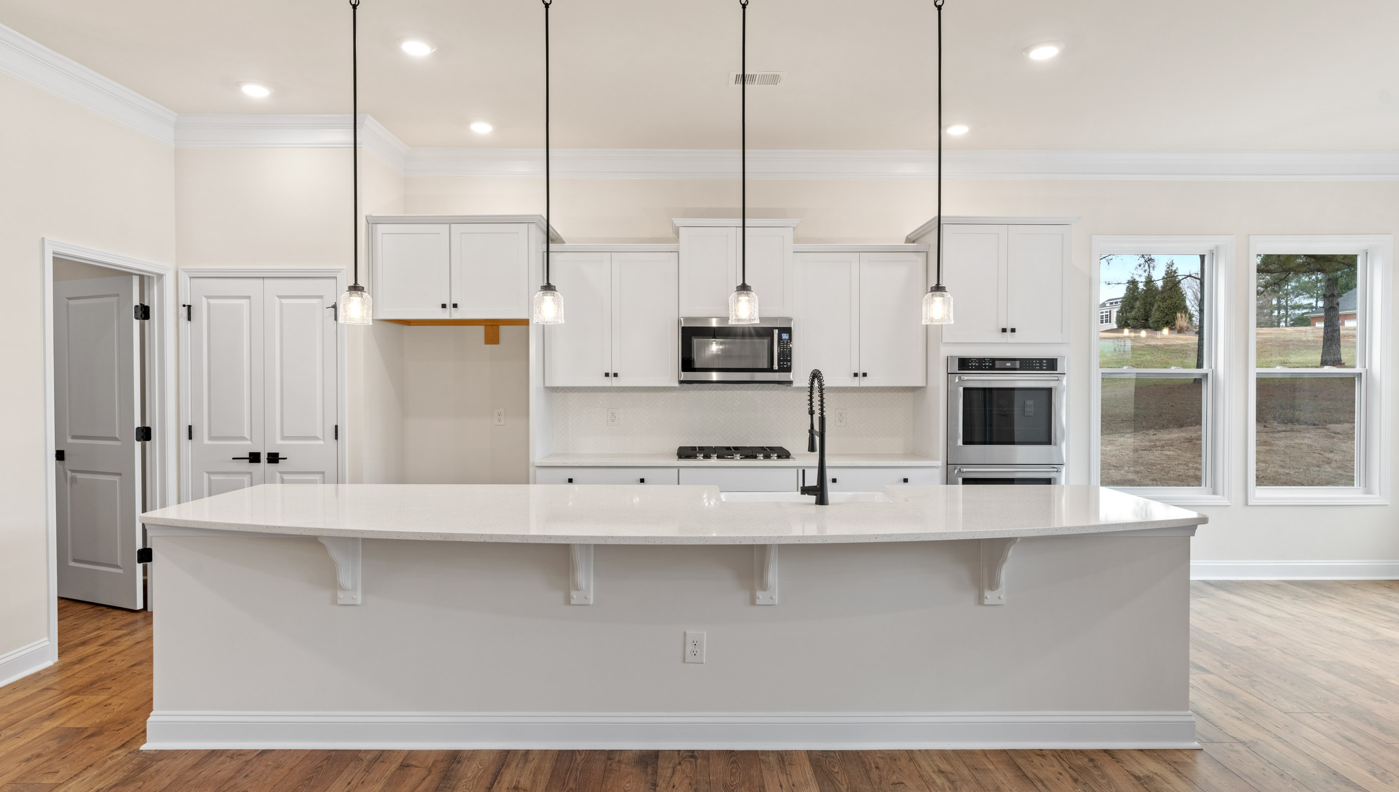 Kitchen and island with granite counter tops.