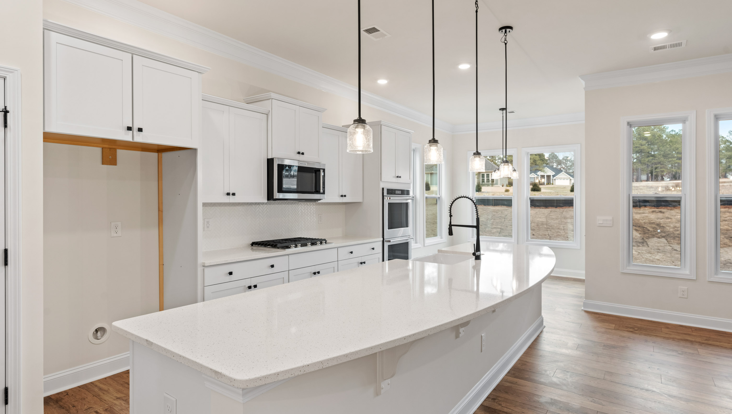 Kitchen and island with granite counter tops.
