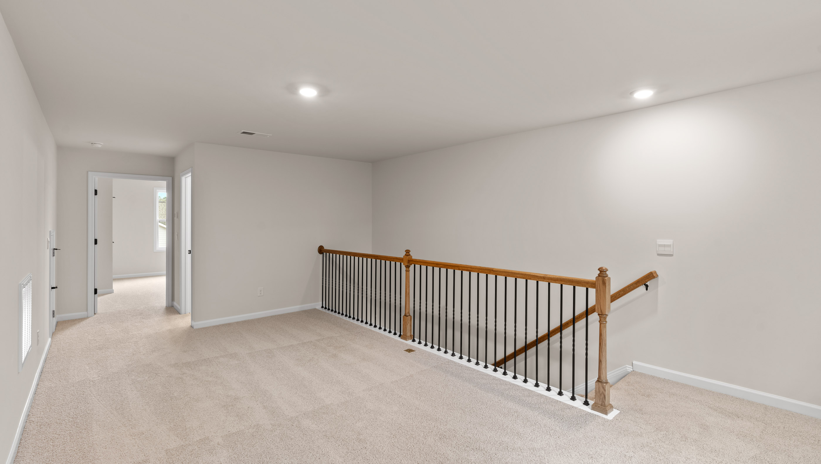 Loft area with carpet.