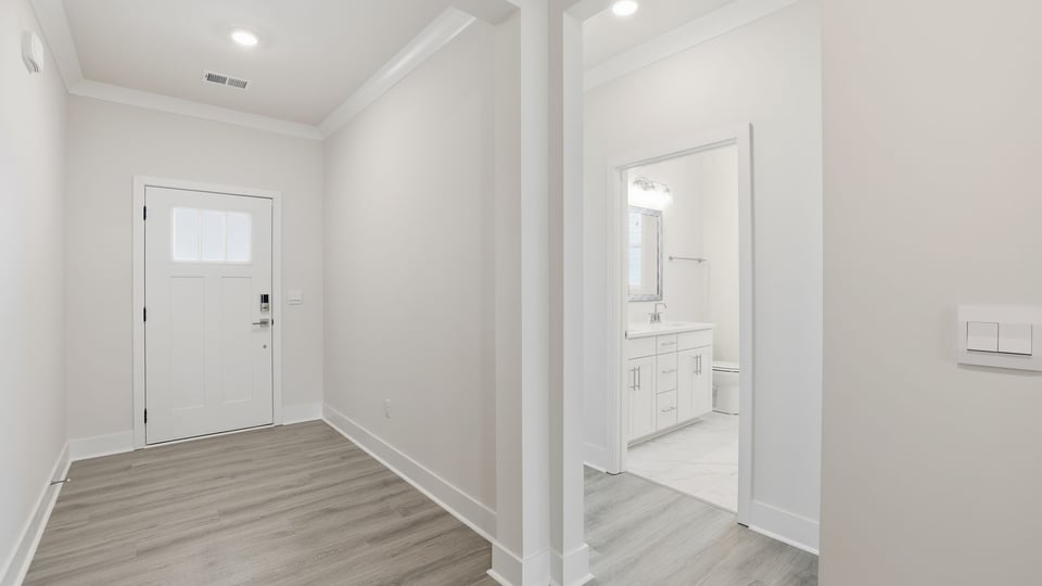 View of entrance and front bedroom.