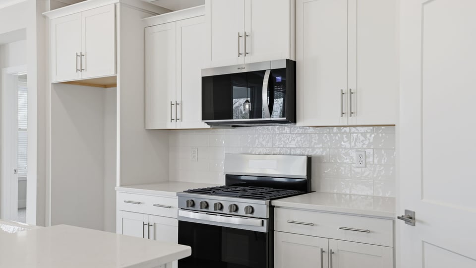 Kitchen features stainless steel appliances.