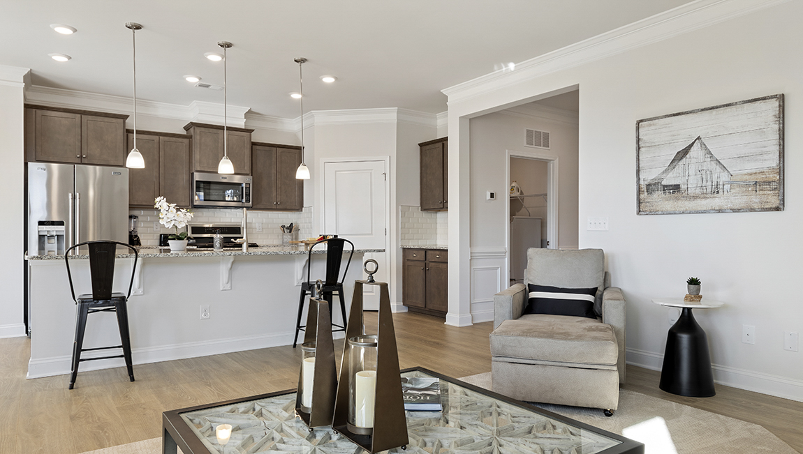 Family room with windows and view and kitchen.