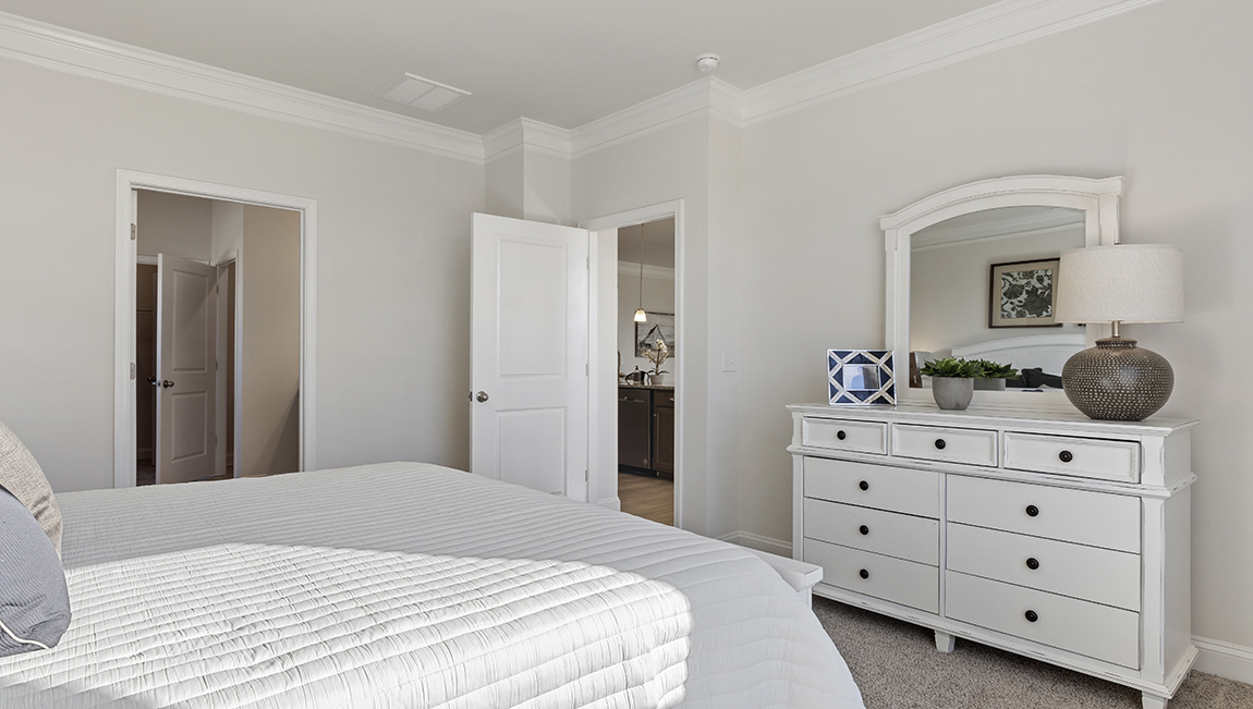 Bedroom with carpet and window.