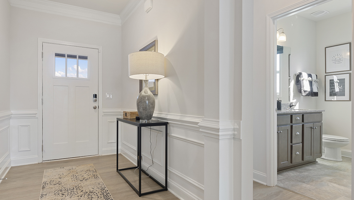 Entry way into home with office and view of front door.