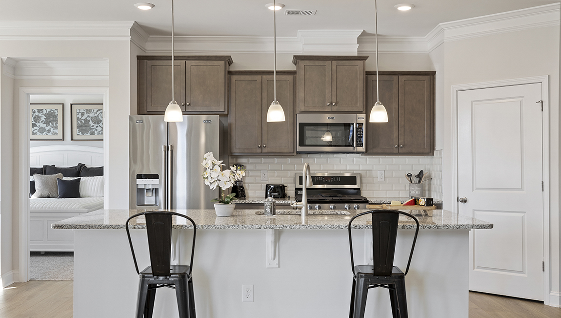 Kitchen and island with granite counter tops.