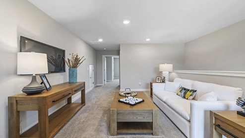 Loft area with carpet.