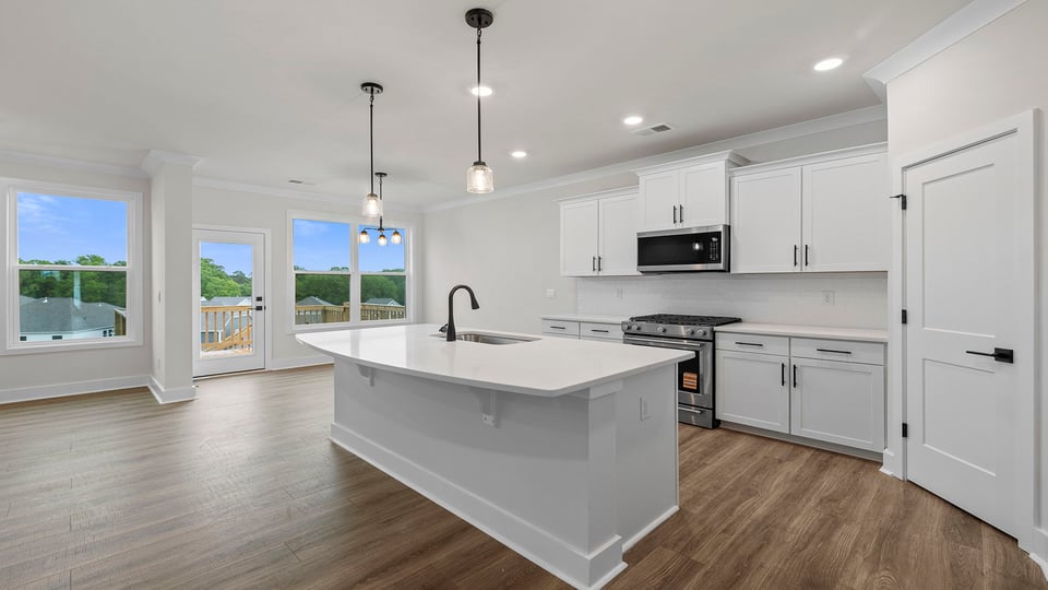 Kitchen with island and cabinets.