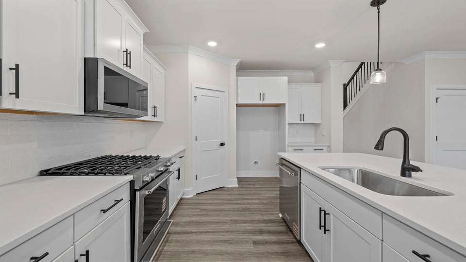 Kitchen with island and cabinets.