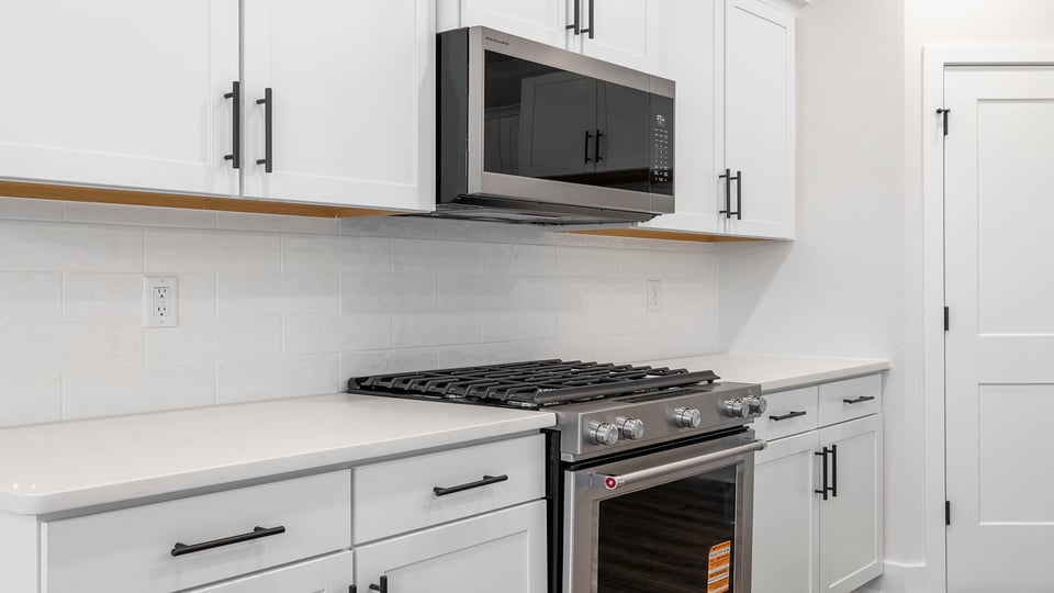 Kitchen with island and cabinets.