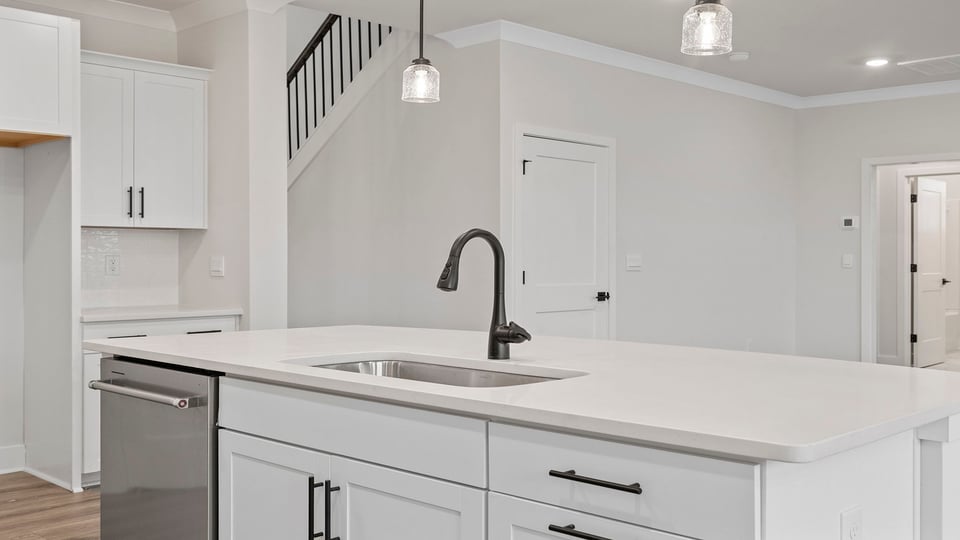 Kitchen with island and cabinets.
