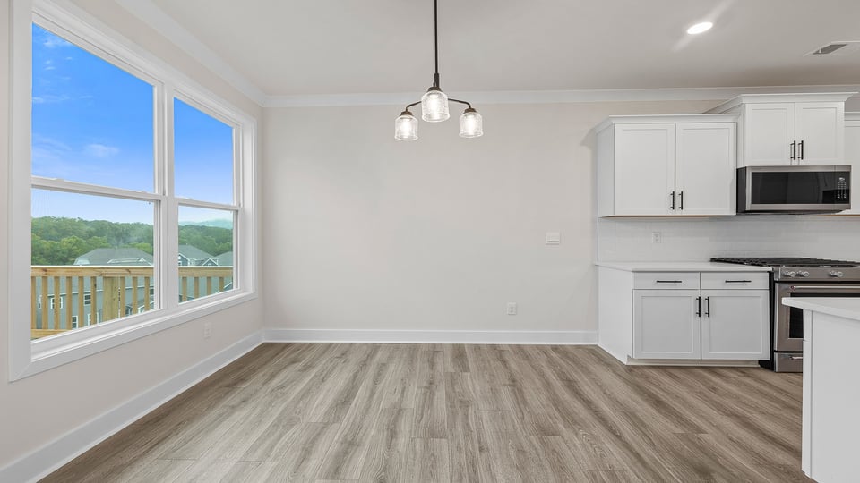 Living area with windows and fireplace.