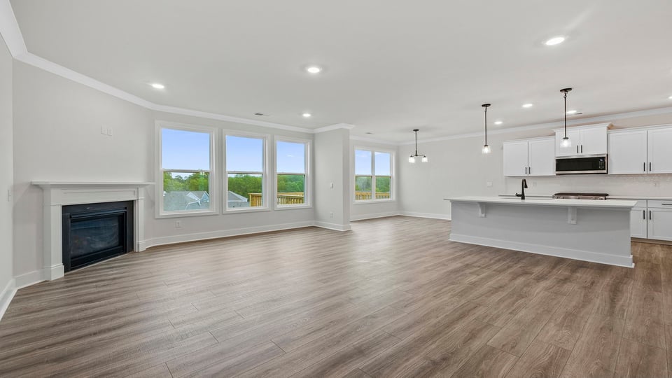 Living area with windows and fireplace.
