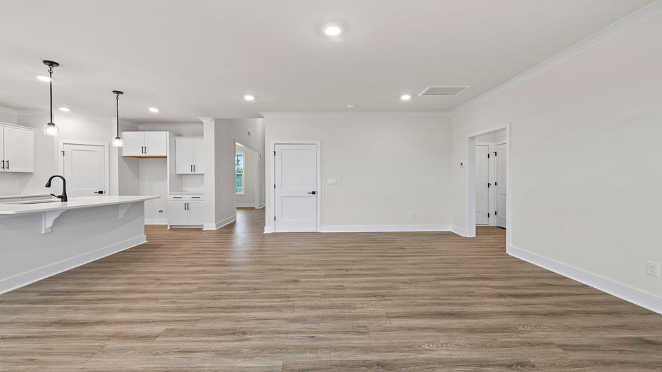Living area with windows and fireplace.