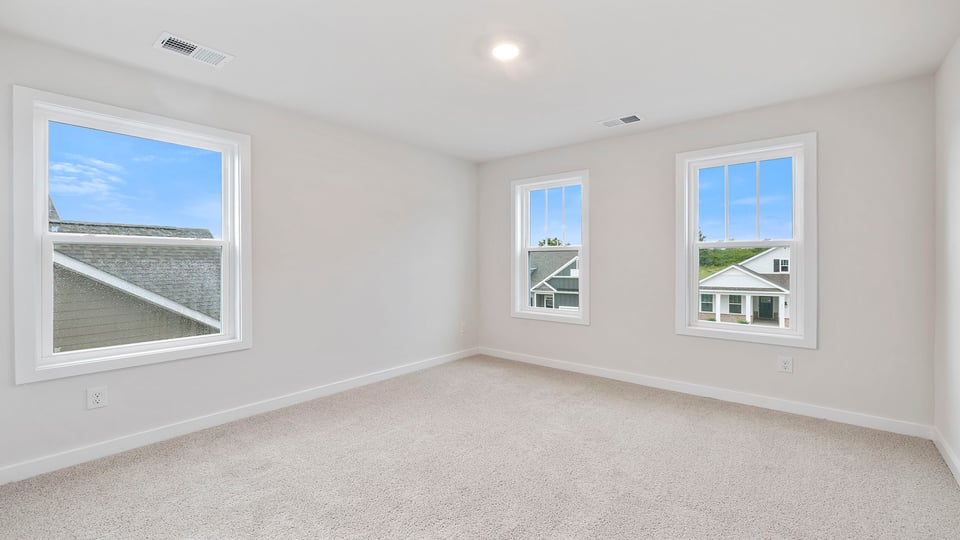 Bedroom with carpet and window/