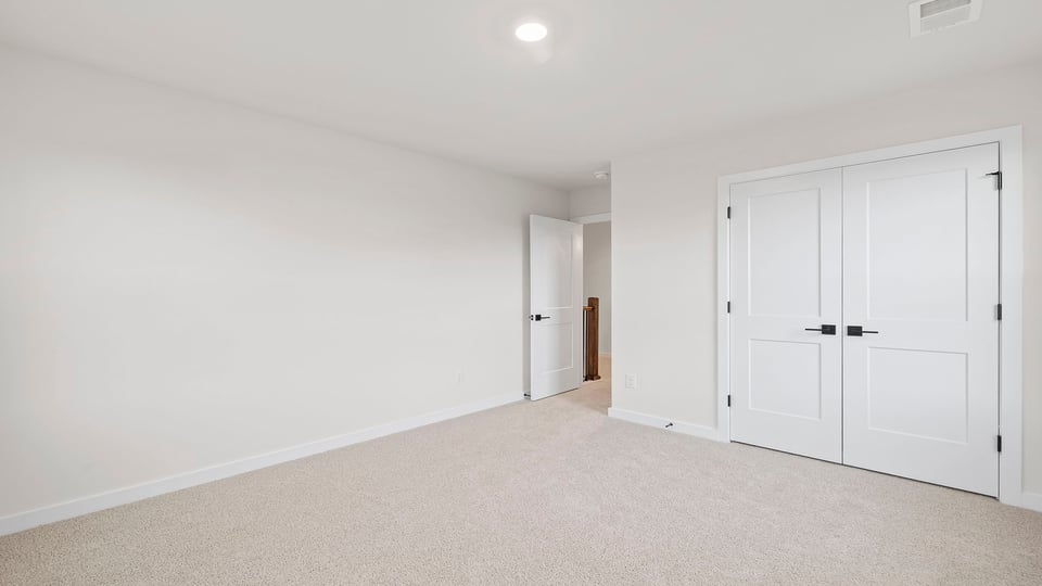 Bedroom with carpet and window/