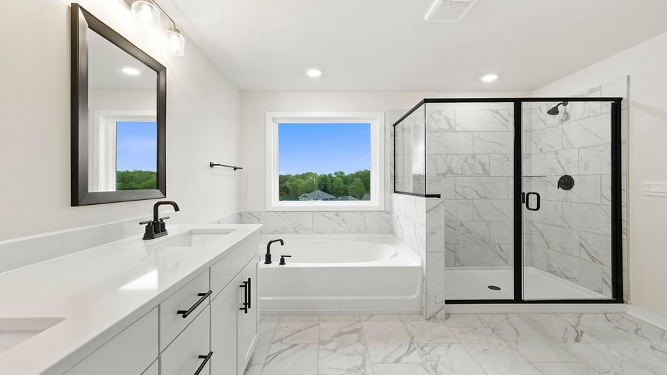 Primary bathroom with double vanity sinks.