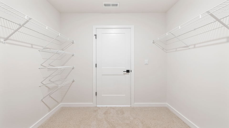 Primary closet with shelf,