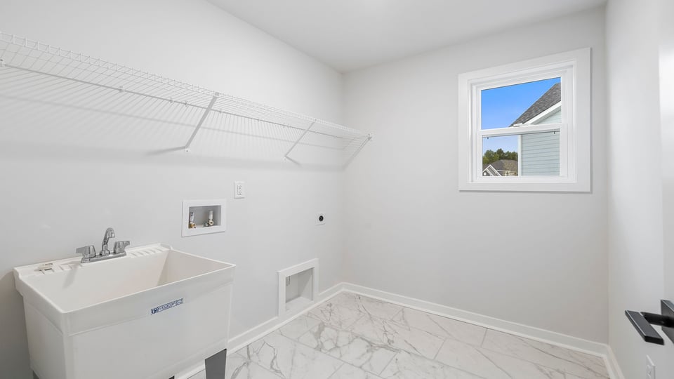 Laundry room with sink.