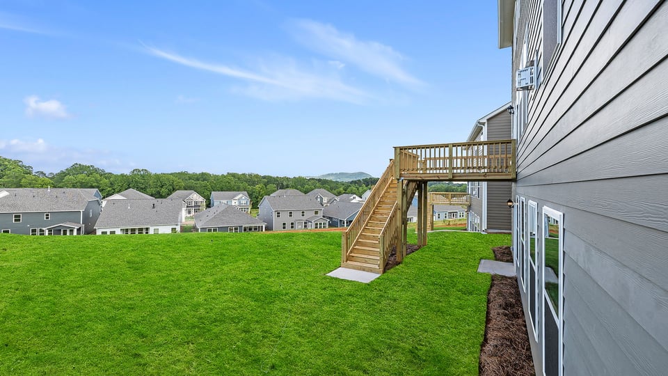 Back exterior with large backyard.