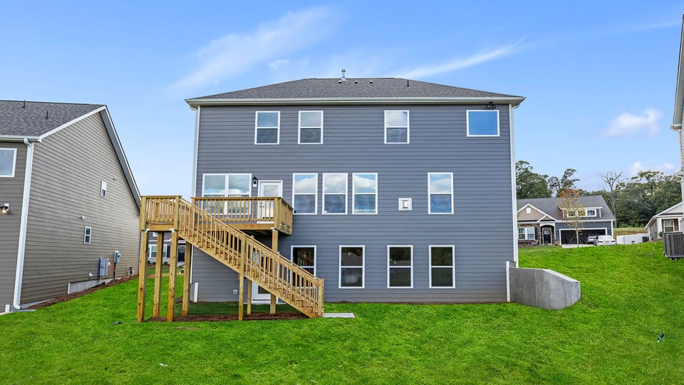 Back exterior with large backyard.