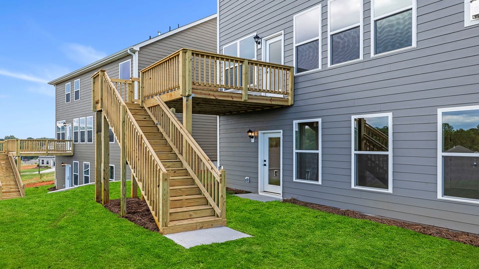 Back exterior with large backyard.