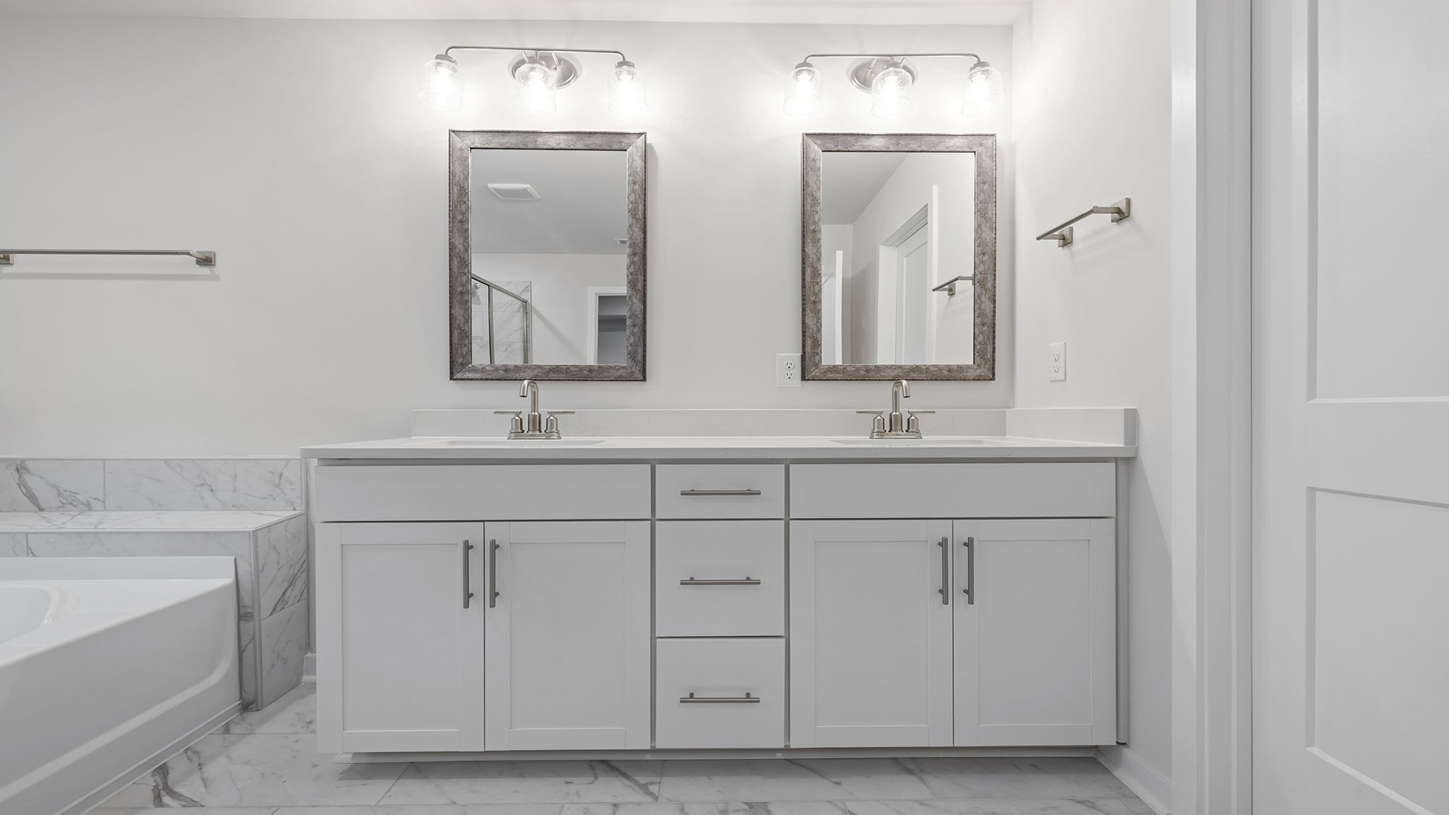 Primary bathroom with dual sink vanity.