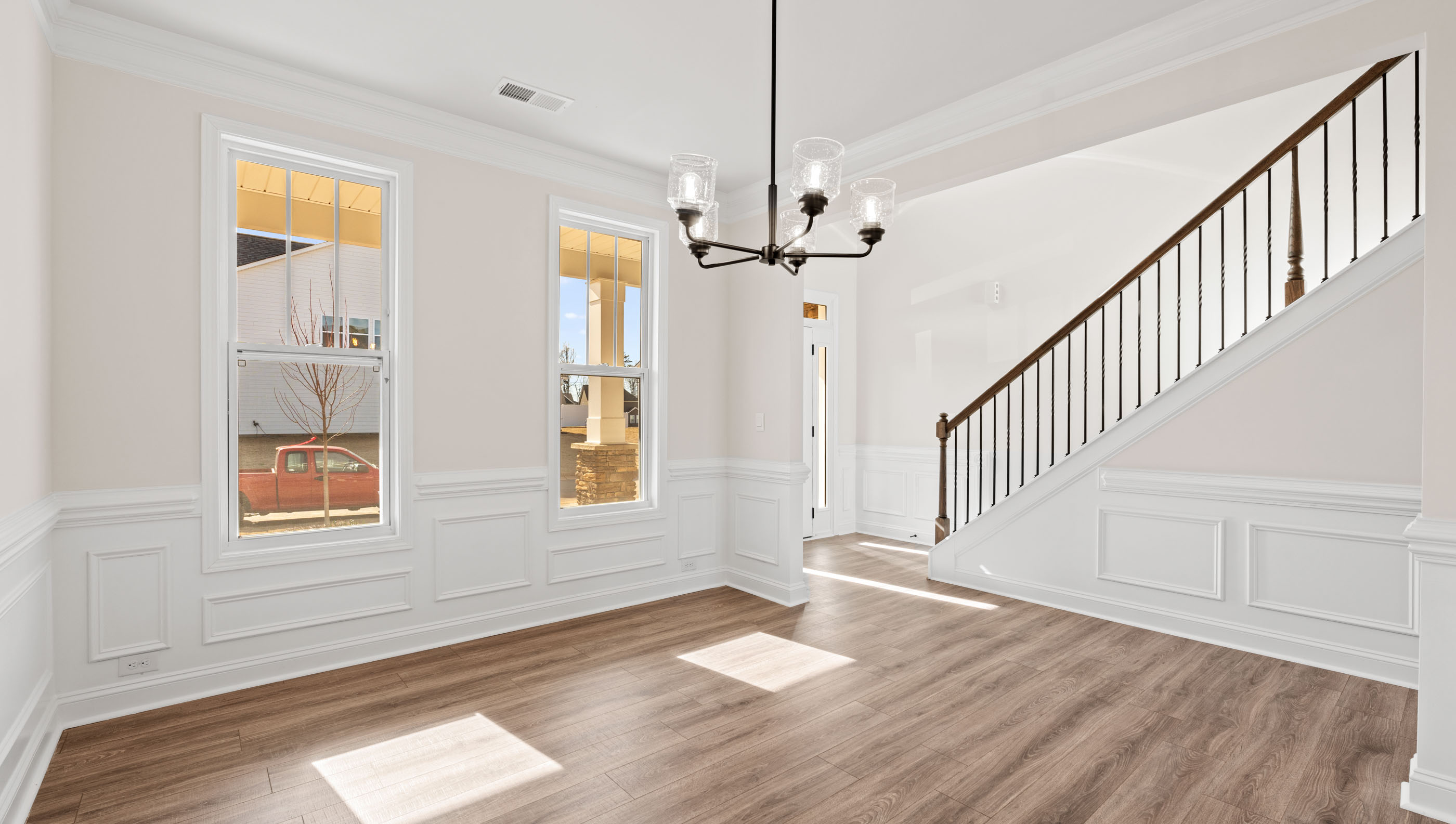 Space at front of home with view of stairs.