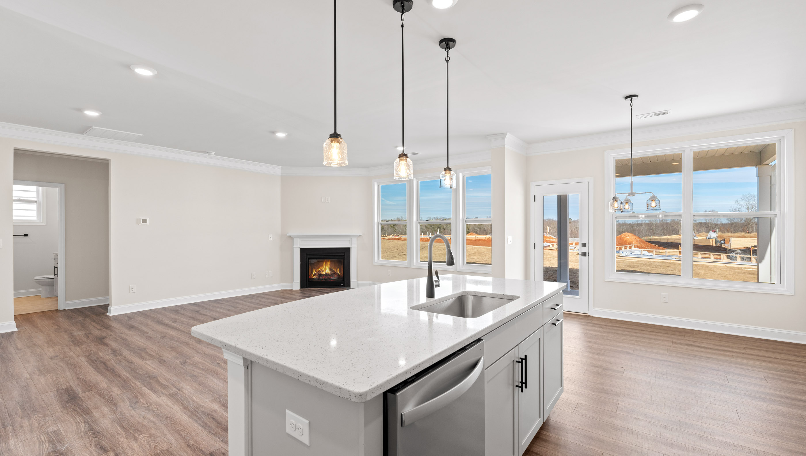 Kitchen and island with granite counter tops.