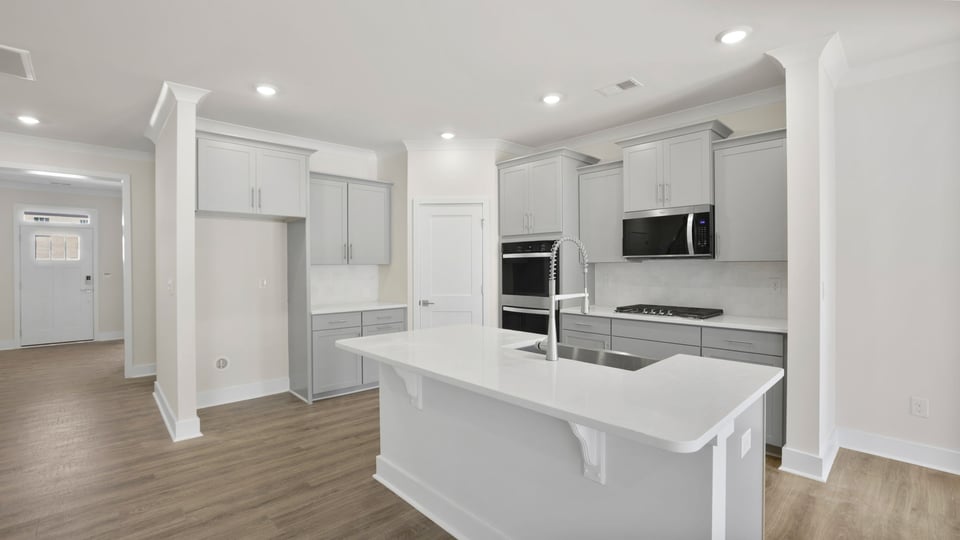 Kitchen with island and cabinets.