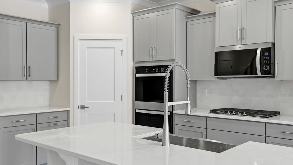 Kitchen with island and cabinets.
