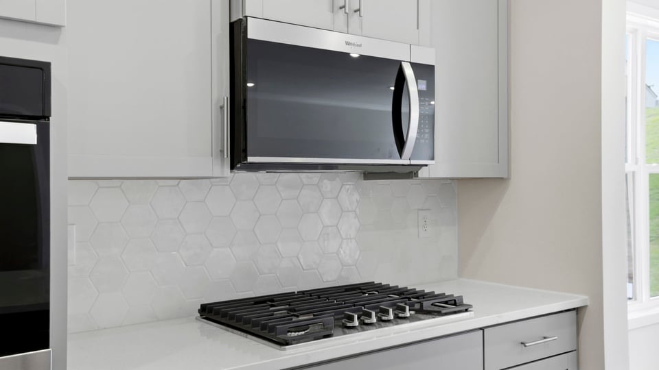 Kitchen with island and cabinets.