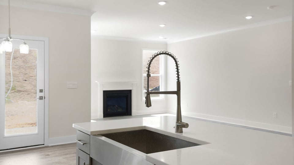 Kitchen with island and cabinets.