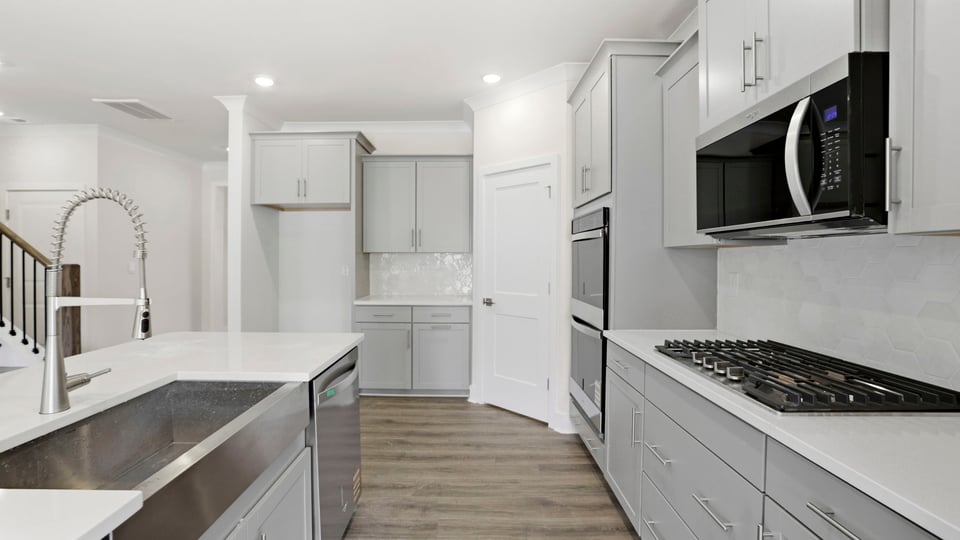 Kitchen with island and cabinets.