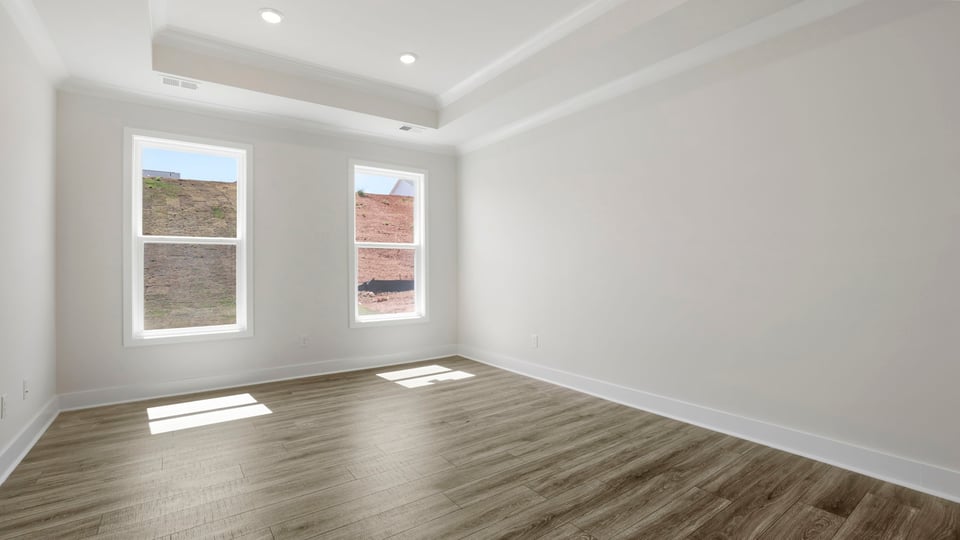 Primary bedroom with windows.